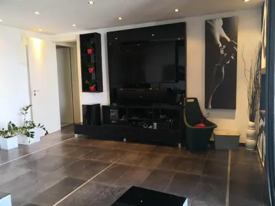 a living room with a large flat screen tv at Fine Designed Flat 302 in Larnaka