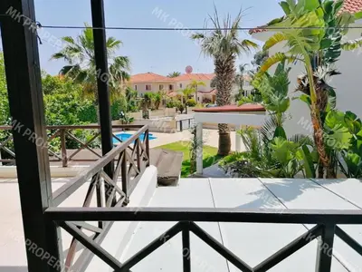 a view of the pool from the balcony of a house at Yiallos Village Apt. A101 in Meneou