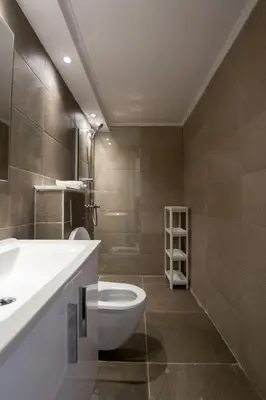 a bathroom with a toilet and a sink at Gevoni Deluxe Suites in Ayia Napa