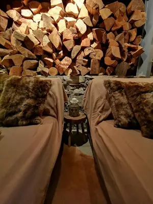 a room with two beds and a pile of wood at Madari Hills Health Retreat in Nicosia