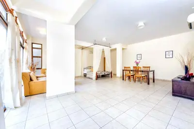 a living room with a couch and a table at Villa Di Gio in Paralimni