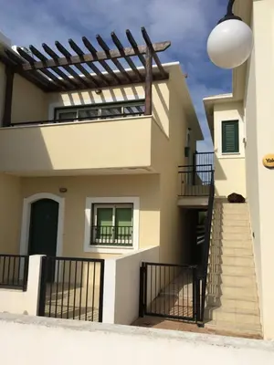 a house with stairs in front of it at Ocean View sunny retreat in Protaras