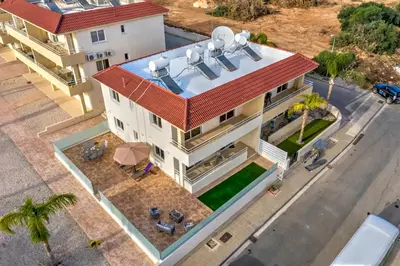 an overhead view of a house with a red roof at Nissi Martha Apartment in Ayia Napa