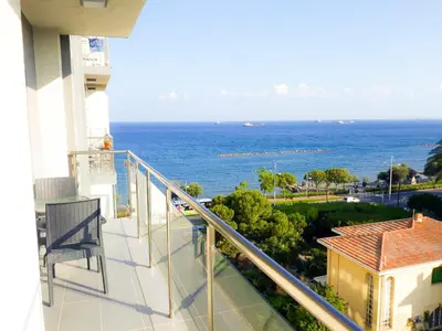 a balcony of a building with a view of the ocean at Thalassa Sea View Suite in Limassol