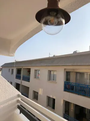 a view of a building from a balcony at AgiaNapaNest studio in Ayia Napa