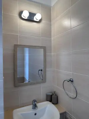 a bathroom with a sink and a mirror at Seana Villa Protaras in Paralimni