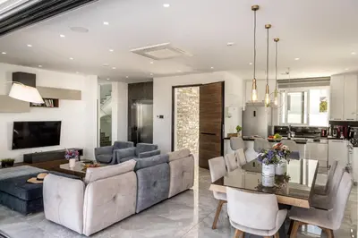 a living room with a couch and a table at Fig Tree Bay Residences 6 in Protaras
