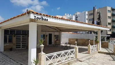 a building with a sign that reads loriaza at ZORBAS No 2 in Larnaka