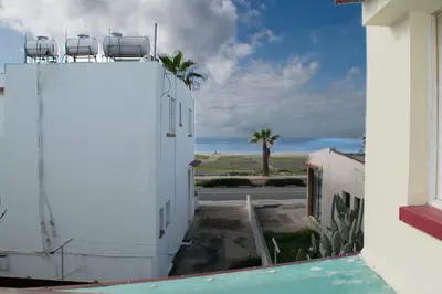 a view of the ocean from the balcony of a building at Merika Complex 1 Hou.32 in Larnaka