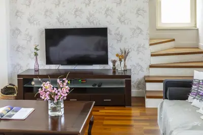 a living room with a tv and a coffee table at Larnaca Villa Marisol Kiti in Larnaka