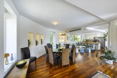 a dining room and kitchen with a table and chairs at Larnaca Villa Marisol Kiti in Larnaka