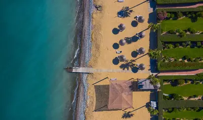 an overhead view of a beach with the ocean at Atlantis Gardens in Mazotos