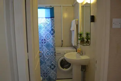 a small bathroom with a sink and a toilet at 13 Sandy Beach Mackenzie in Larnaka
