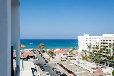 a view of a busy city street with the ocean at Mandali Hotel in Protaras