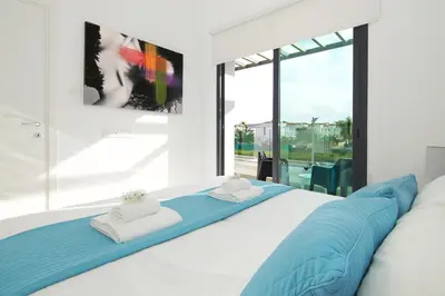 a bedroom with a large bed with two towels at Villa Martha in Protaras
