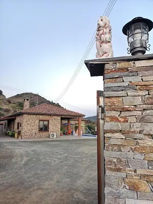 a statue of a lion sitting on top of a building at Kalamospito Holiday House in Kalokhorio