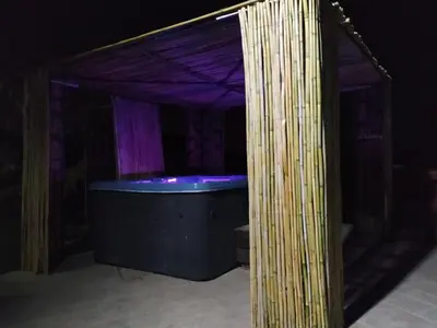 a bath tub in a room with a purple ceiling at Kalamospito Holiday House in Kalokhorio
