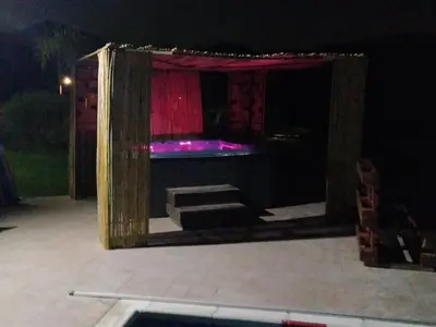 a stage with a red curtain and some steps at Kalamospito Holiday House in Kalokhorio