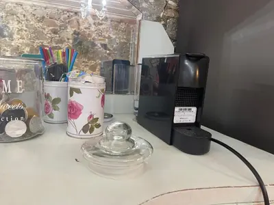 a counter with a coffee maker and a phone on it at Holiday House Prodromos in Prodromos