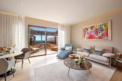 a living room with a couch and a table at Four Seasons Hotel in Limassol