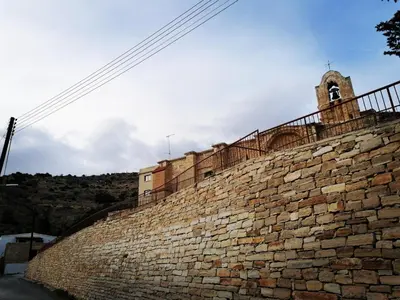 a brick wall with a church on top of it at CASAVERO in Voroklini