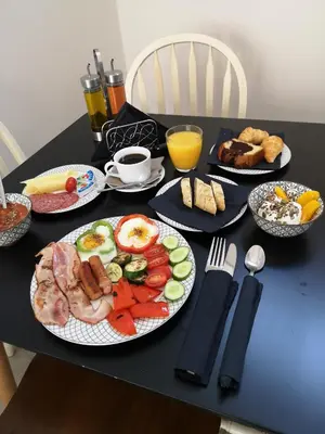 a black table with plates of breakfast food on it at 9 Muses Hotel in Larnaka