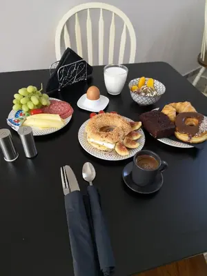 a black table topped with plates of breakfast foods at 9 Muses Hotel in Larnaka
