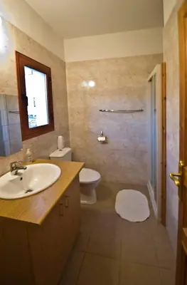 a bathroom with a sink and a toilet at Lania Royal Oak House by TrulyCyprus in Lania