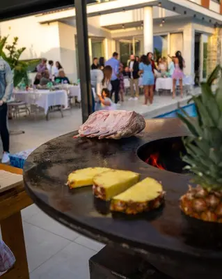 a plate of food with meat and cheese on a table at Napa Hills Seaview Villas in Ayia Napa