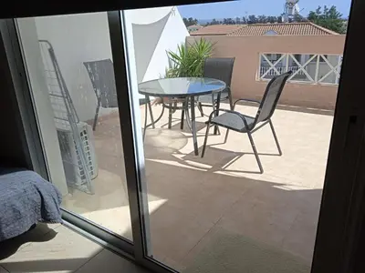 a view of a patio with a table and chairs at Xylophagou Larnaca Ayia Napa 1 bedroom apartment in Xylophaghou
