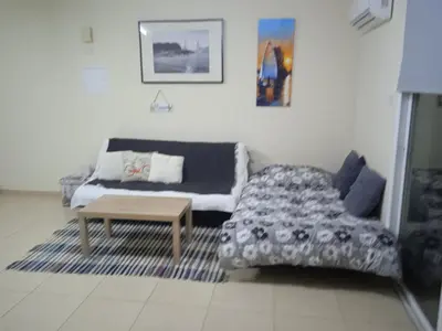 a living room with a couch and a coffee table at Xylophagou Larnaca Ayia Napa 1 bedroom apartment in Xylophaghou