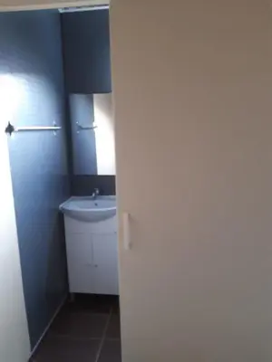 a small bathroom with a sink and a toilet at City Center Holiday room in Limassol