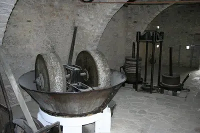 a bath tub in a room with a stone wall at The Spidaki in Lania
