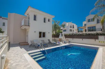 a swimming pool in front of a house at Protaras View Villa 5 in Protaras
