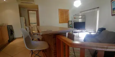 a kitchen with a table and chairs in a room at Palm beach 14 in Limassol
