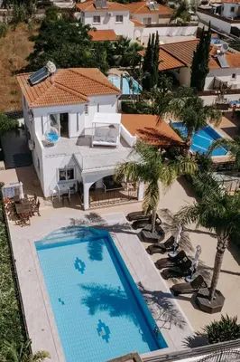 an aerial view of a house with a swimming pool at Sunset Villa private complex heated pool in Ayia Napa