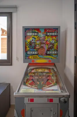 a pinball machine in a room with a game at Villa Fortuna in Ayia Napa