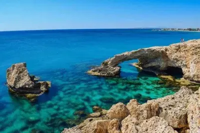 a large body of water with rocks and blue water at Sunrise Villa in Ayia Napa