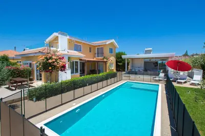 a swimming pool in front of a house at Ayia Napa Villa Danae in Ayia Napa