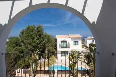 a view from the balcony of a villa with a swimming pool at Villa Anatoli - Cape Greco in Protaras