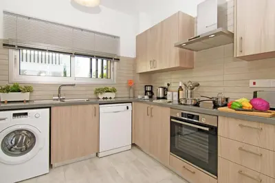 a kitchen with a washer and a dishwasher at Villa Lily in Protaras