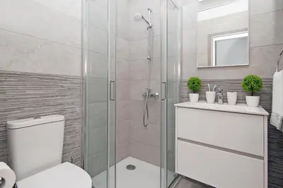 a bathroom with a shower with a toilet and a sink at Villa Lily in Protaras