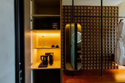 a room with a shower with a phone in it at Cavo Zoe Seaside Hotel in Protaras