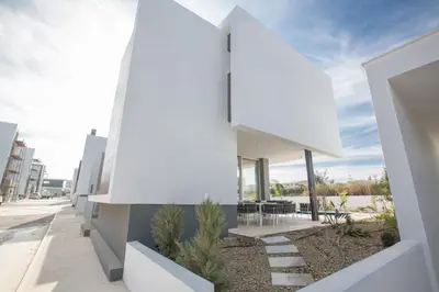 a white house with a view of the street at Olivine Pearl Villas in Protaras