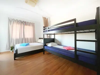 two bunk beds in a room with wooden floors at Napa Blue Apartment, XXL Pool,in Hearth of Ayia Napa in Ayia Napa