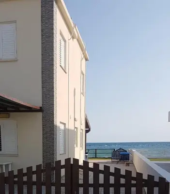 a building with a view of the ocean at Panorama Beach House, 5 meters to the sea in Pervolia