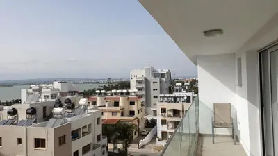 a view of a city from the balcony of a building at La Veranda Hotel in Larnaka