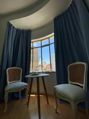 a room with two chairs and a table and a window at Unique Studios Phaneromenis 41 - Down Town Nicosia in Nicosia