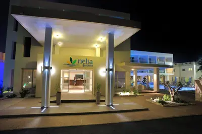 a nida store at night with lights at Nelia Gardens in Ayia Napa