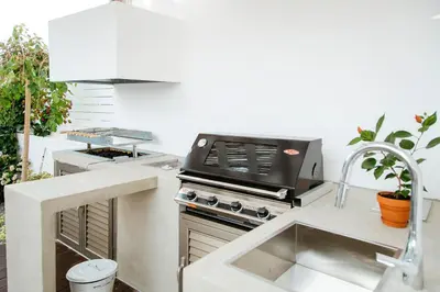 a kitchen with a stove and a sink at Island Home Seaside Villa in Paralimni